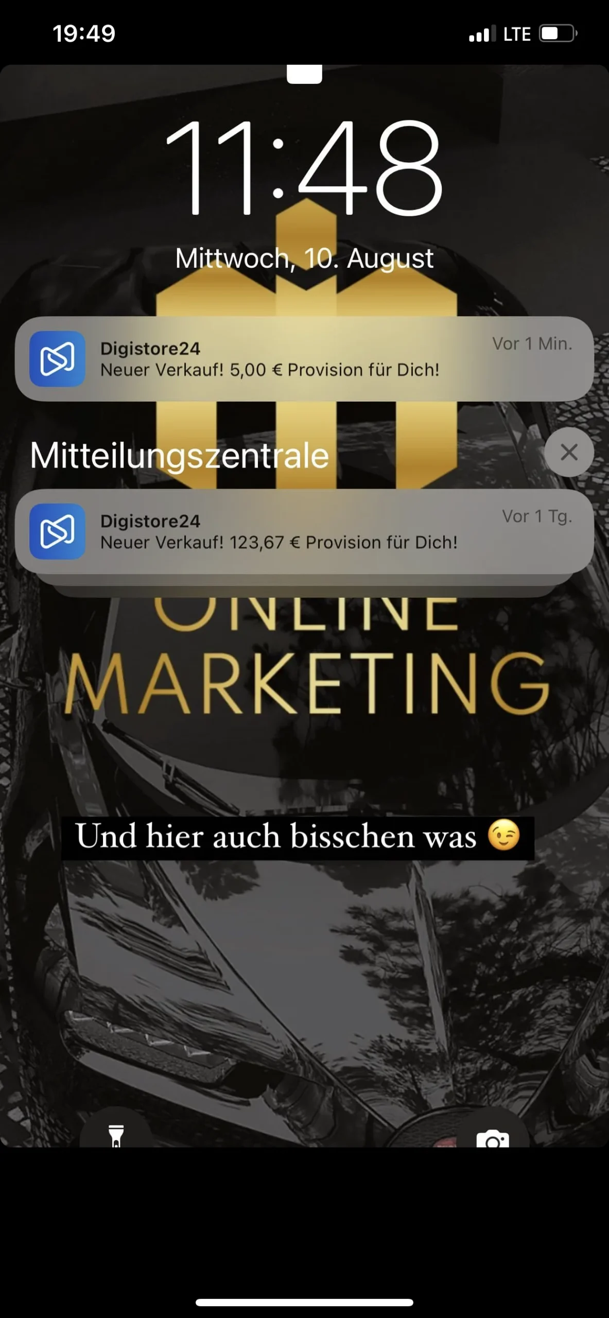 iPhone-Lockscreen-Screenshot mit Ilias Marketing Icon Gold und Benachrichtigungen von Digistore24