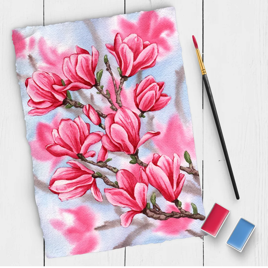 Aquarellmalerei mit pinken Magnolienblüten auf Papier mit Pinsel und Farbpalette