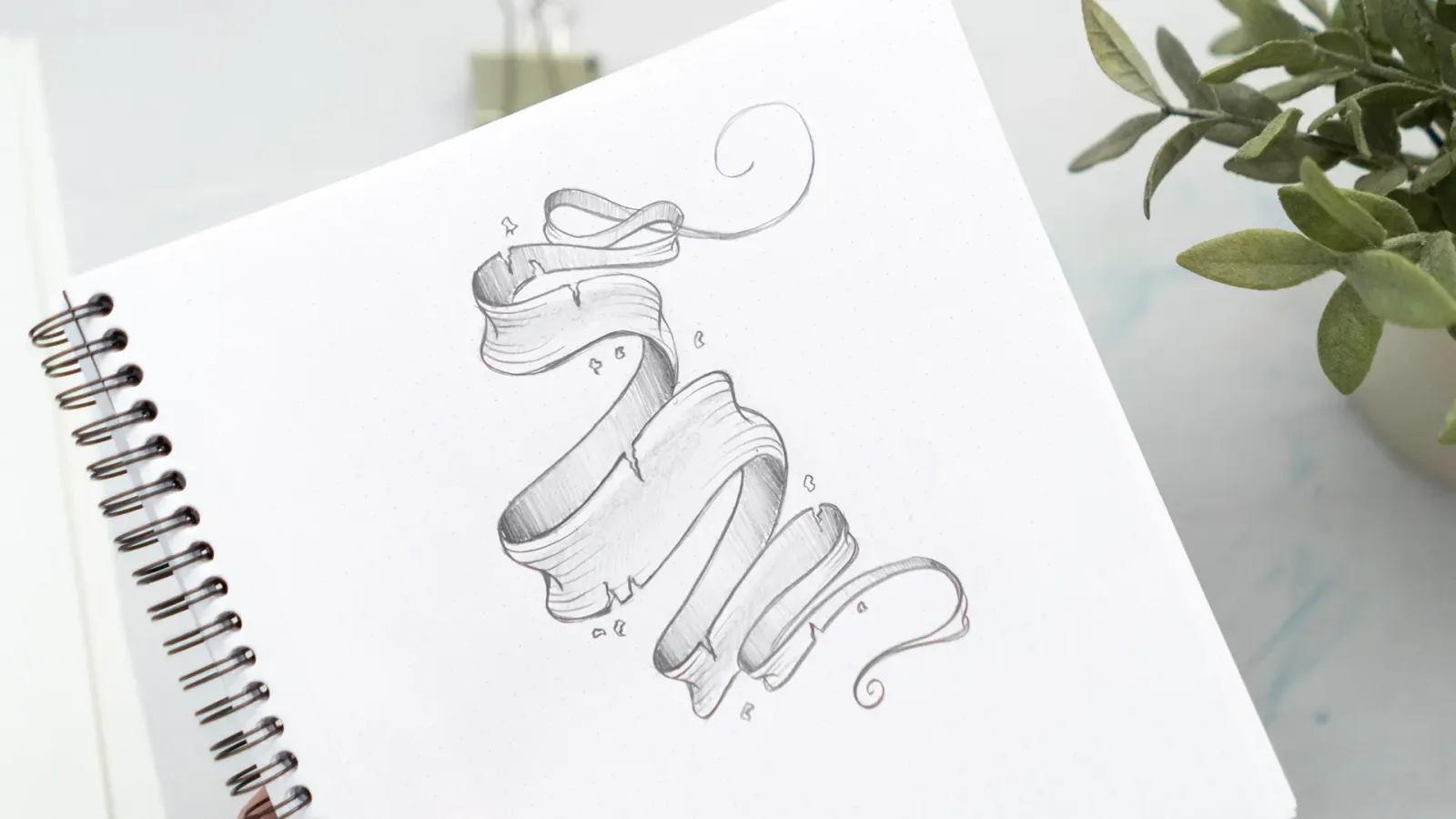 Detailed Bleistiftskizze realistischer 3D-Banner mit Schattierungen auf Spiralblock