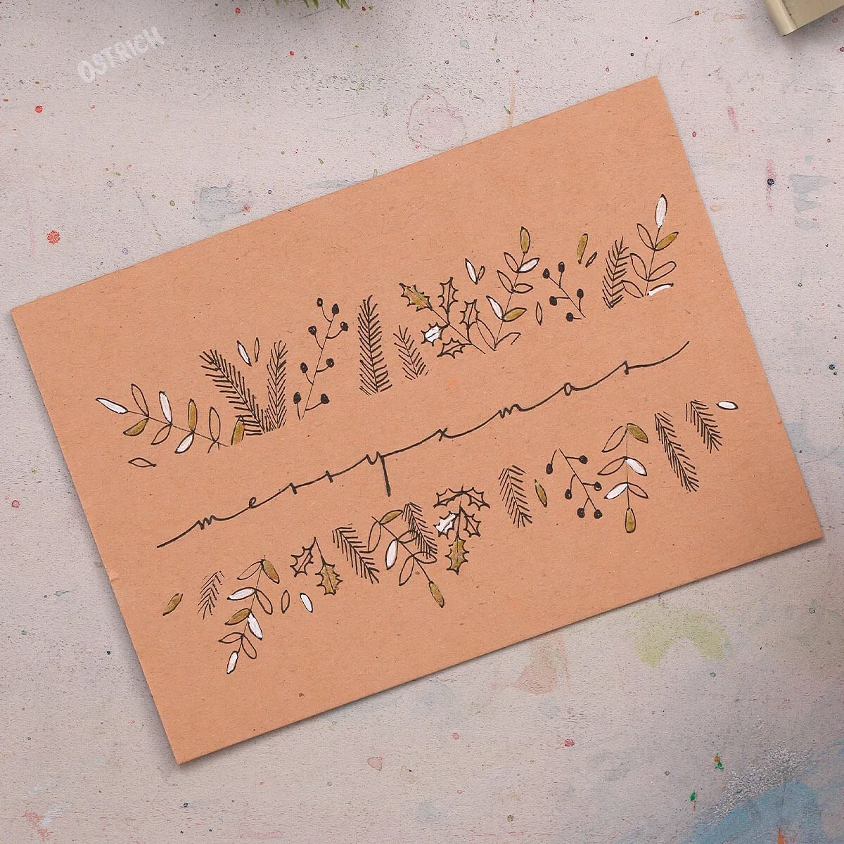 Extended Lettering Guide – E-Book zu breiten Schriftzügen 7 Handlettering 'merry xmas' mit Blatt- und Weihnachtsdekoration auf pfirsichfarbenem Papier
