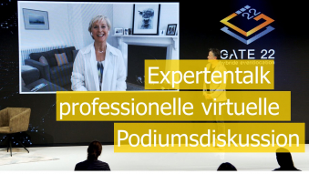 Frau auf Monitor mit Text virtuelle Podiumsdiskussion