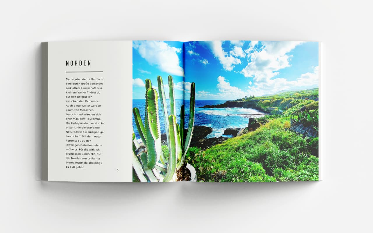 Aufgeschlagener La Palma Bildband Seite 'NORDEN' mit Text und großem Foto von Kaktus vor Küstenlandschaft mit blauem Meer