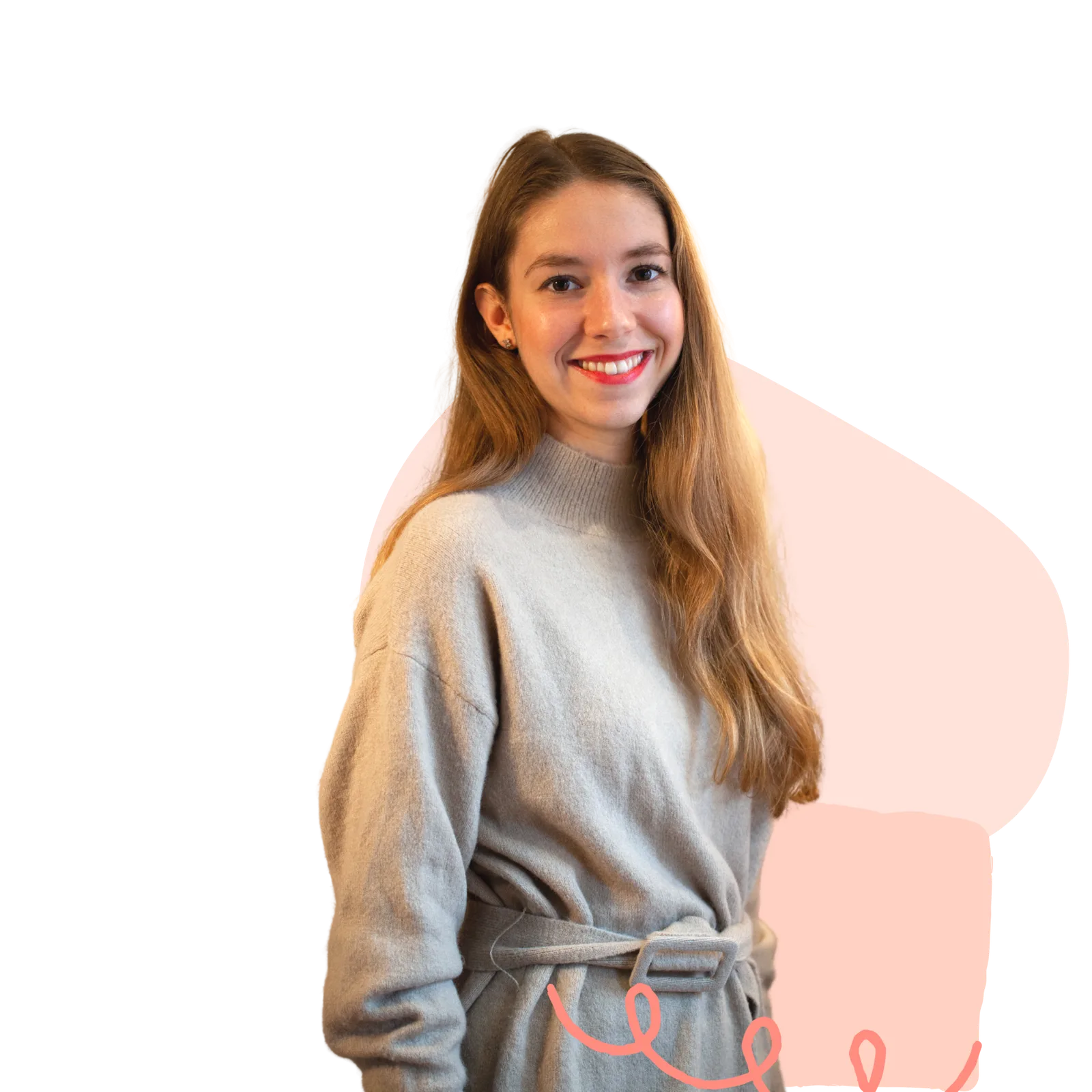 Porträt der Kursinstruktorin Katy mit grauem Pullover vor rosa Hintergrund