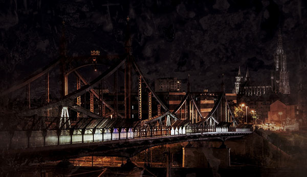 Nachtfotografie der Ulmer Donaubrücke mit Münster im Hintergrund, warm beleuchtet