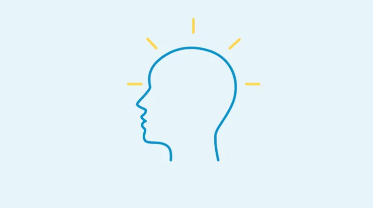 Icon mit blauem Kopfprofil und gelben Strahlungslinien auf hellblauem Hintergrund, symbolisiert Mindset und Gedanken