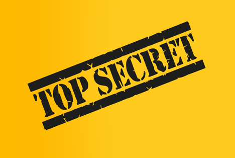 TOP SECRET Stempel auf gelbem Hintergrund diagonal angeordnet