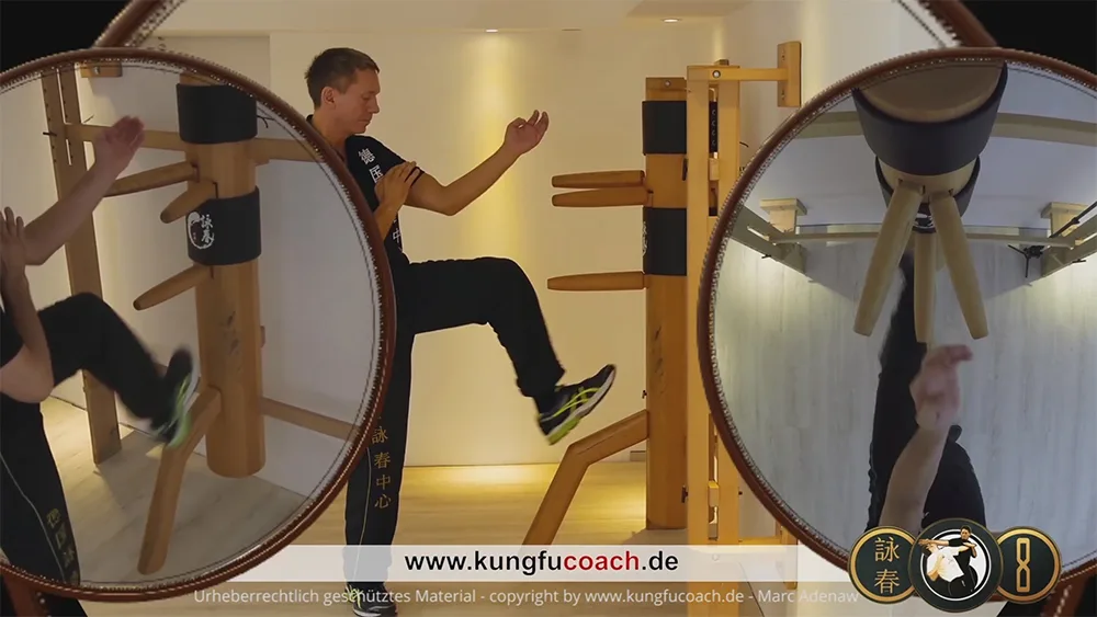 Trainer demonstriert Bewegungsfolge mit großem roten Trainingsring im spiegelnden Studio