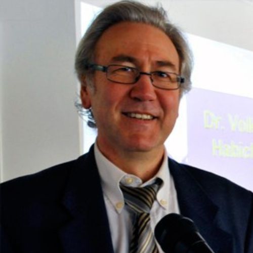 Porträtfoto von Volker Schmiedel, Mann mit grauem Haar, Brille, dunklem Anzug und Krawatte