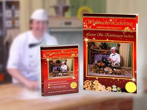 DVD-Box und Backbuch des Weihnachtsbackkurs mit Reiner Bernhardt im unscharfen Hintergrund