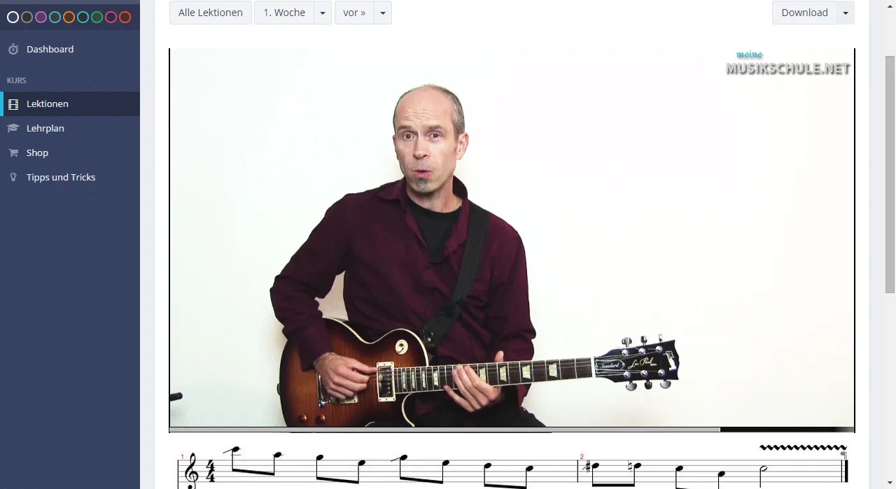 Screenshot: Kurs-Dashboard mit Lektionsliste, Andreas Vockrodt im Video mit E-Gitarre und Noten