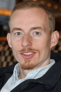 Porträtfoto von Raik Garve, männlicher Speaker mit hellbraunen Haaren