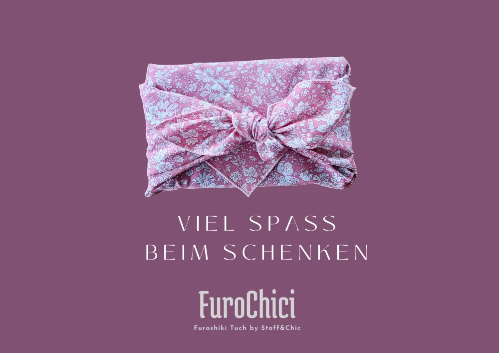 Rosa Furoshiki-Tuch mit Blumenmuster auf lila Hintergrund
