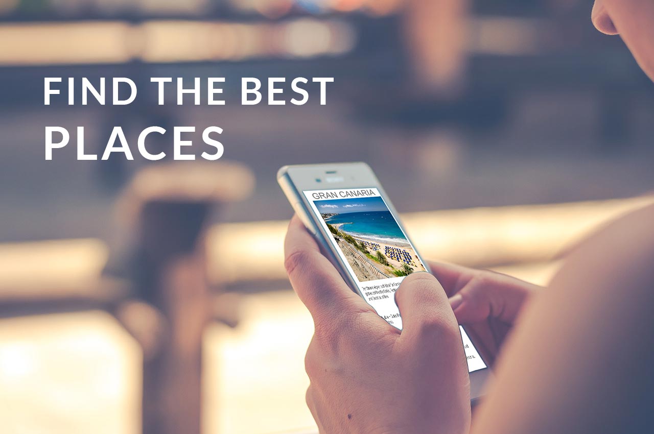 Smartphone in Hand mit Gran Canaria Strand-Bild und Text Find the Best Places