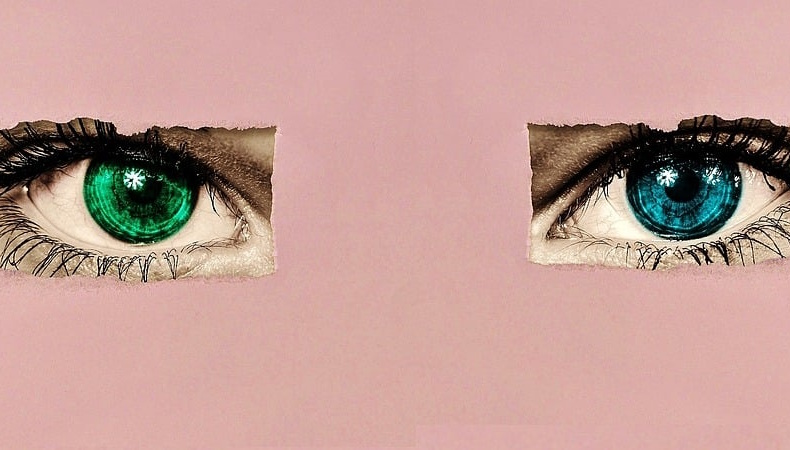 Illustration zweier Augen mit grüner und blauer Iris auf rosa Hintergrund
