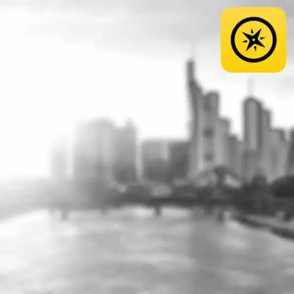 Kompass-Icon mit gelbem Quadrat über verschwommener Stadtsilhouette