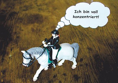 Grafik Fokus und Konzentration mit Reiter und Gedankenblase