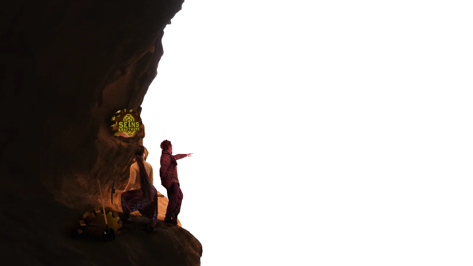Zwei Menschen in Felshöhle mit Seinskraftwerk Logo und warmem Licht
