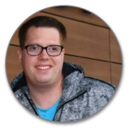 Porträtfoto junger Mann mit Brille und grauem Hoodie, kreisformat
