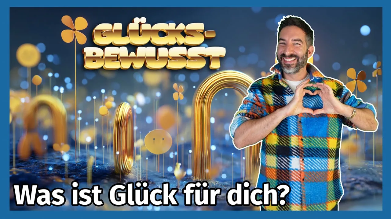 Videostandbild mit Text Glücksbewusst, Oliver Brandenburg im kariertem Hemd mit Herzzeichen