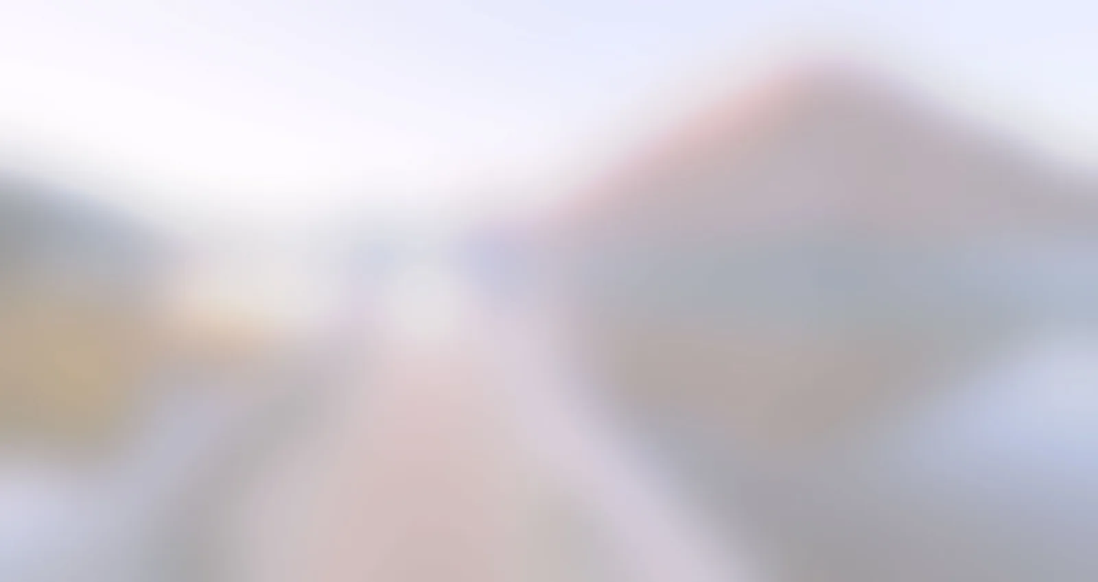 Unscharfer Hintergrund mit sanften Farbverläufen in Blau, Rosa und Beige